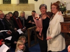 Lyn presenting flowers to Jackie Broughton
